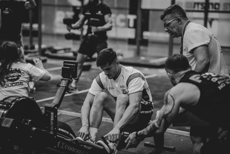 athlete performing high intensity interval training on rowing ergometer