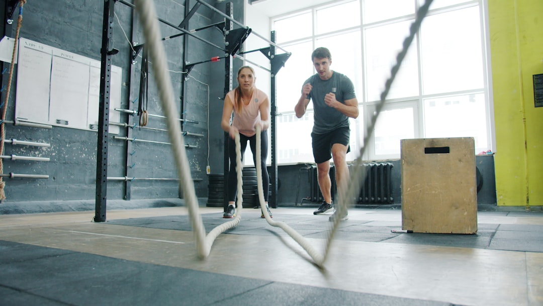 athlete running on curved non-motorised treadmill in performance gym