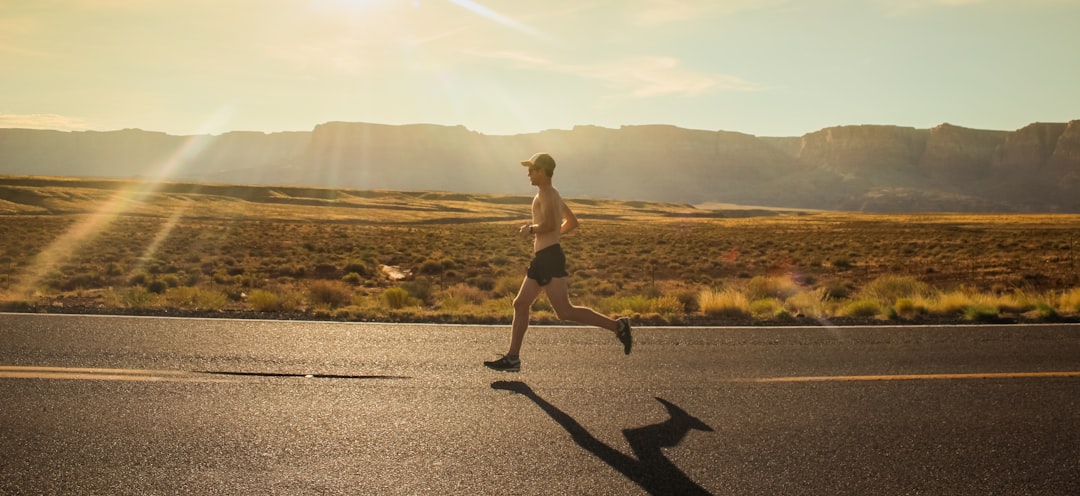 Athlete running on a road during marathon training