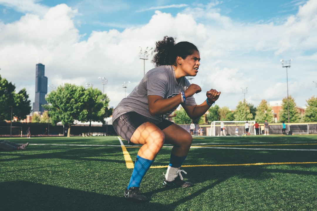 athlete using resistance bands for hip activation warm up exercise