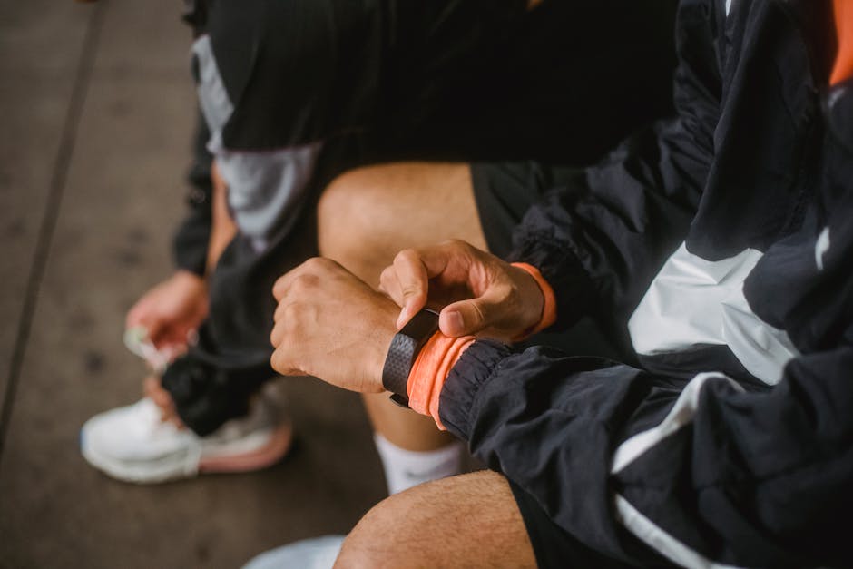athlete wearing GPS sports watch during outdoor trail run