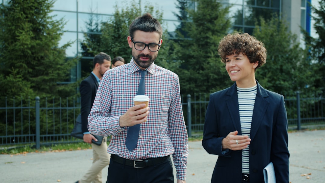 employees walking together outside office building during lunch break fitness challenge