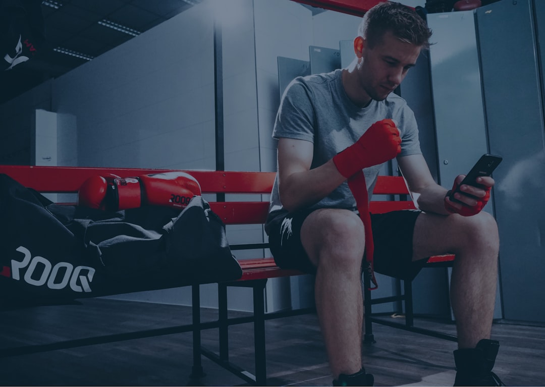 gym user reviewing fitness app pros and cons on phone