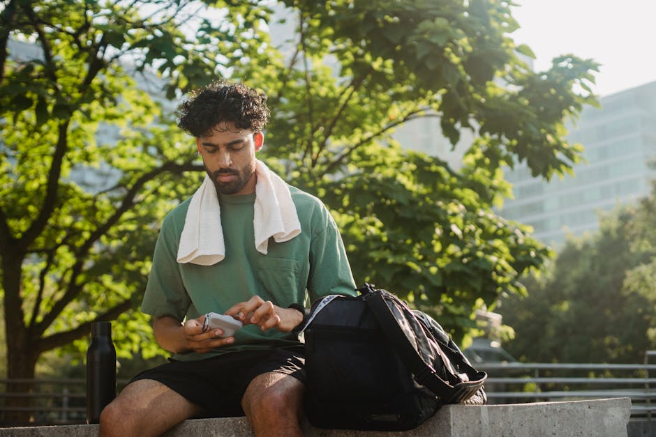 person wearing Oura Ring Gen 3 checking smartphone recovery data after morning run