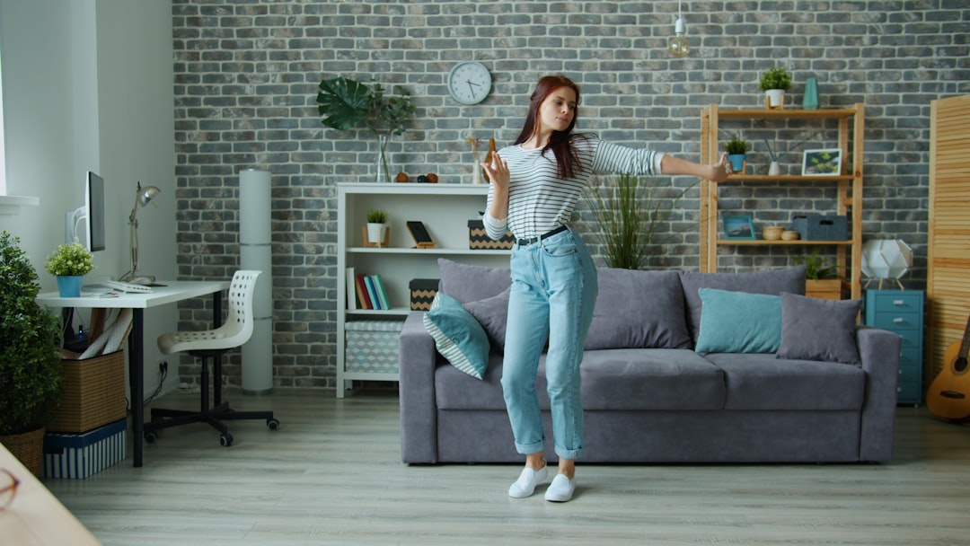 woman doing dance cardio workout at home living room