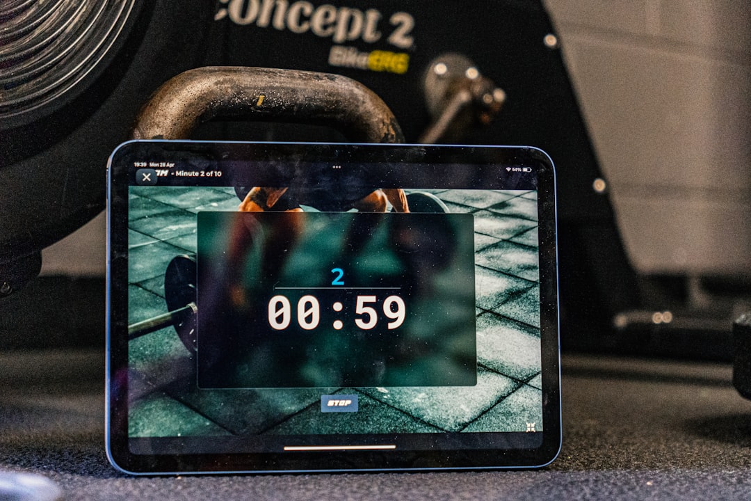 AI fitness app generating personalised strength training programme on tablet