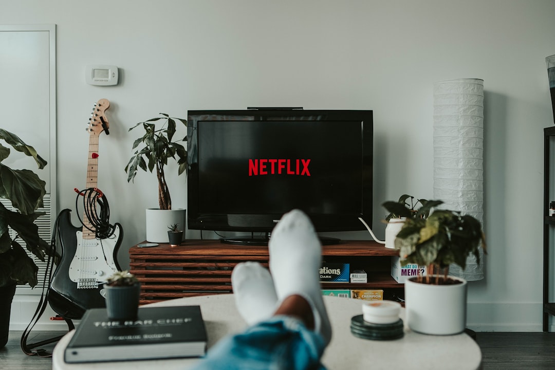 person working out at home using fitness streaming app on TV