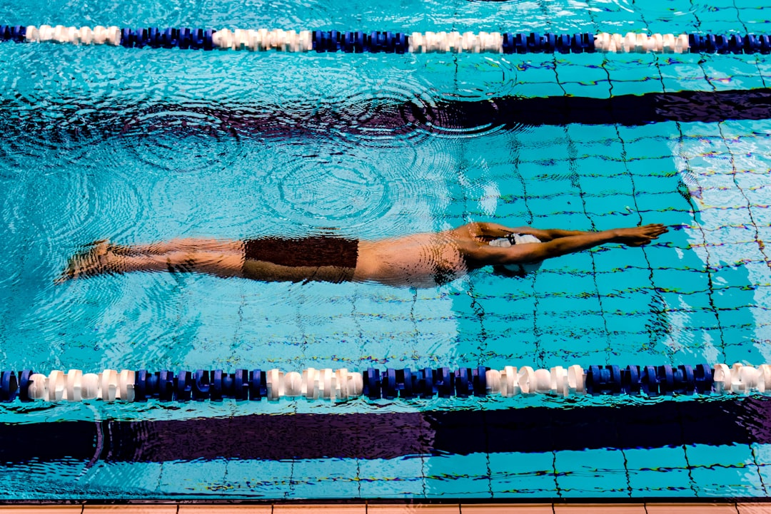 FORM Smart Swimming Goggles worn by swimmer in pool lane