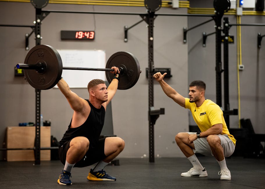 Person performing barbell back squat in commercial gym, viewed from side angle showing form