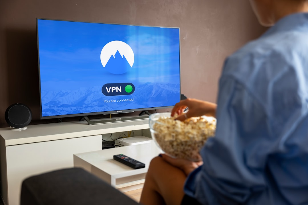 Person using fitness streaming app on smart TV during home workout