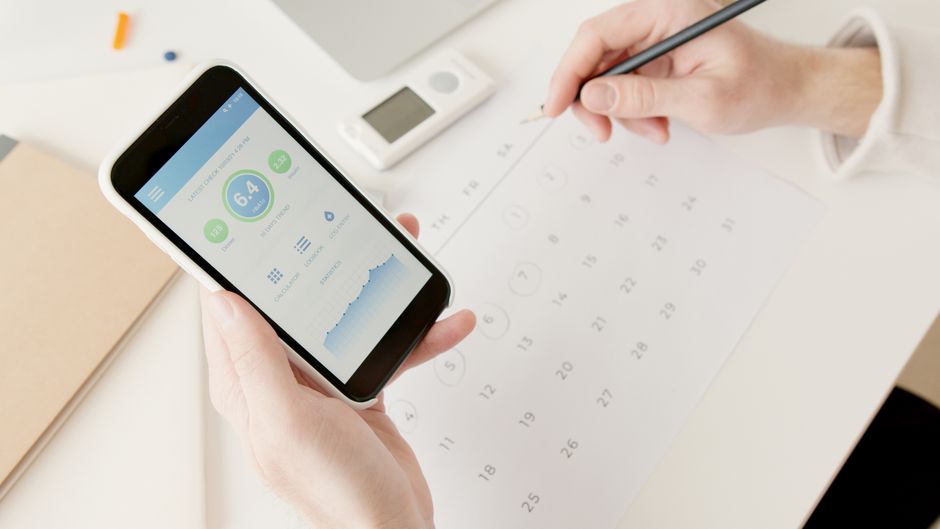 Renpho Smart Body Scale on bathroom floor with smartphone showing app data
