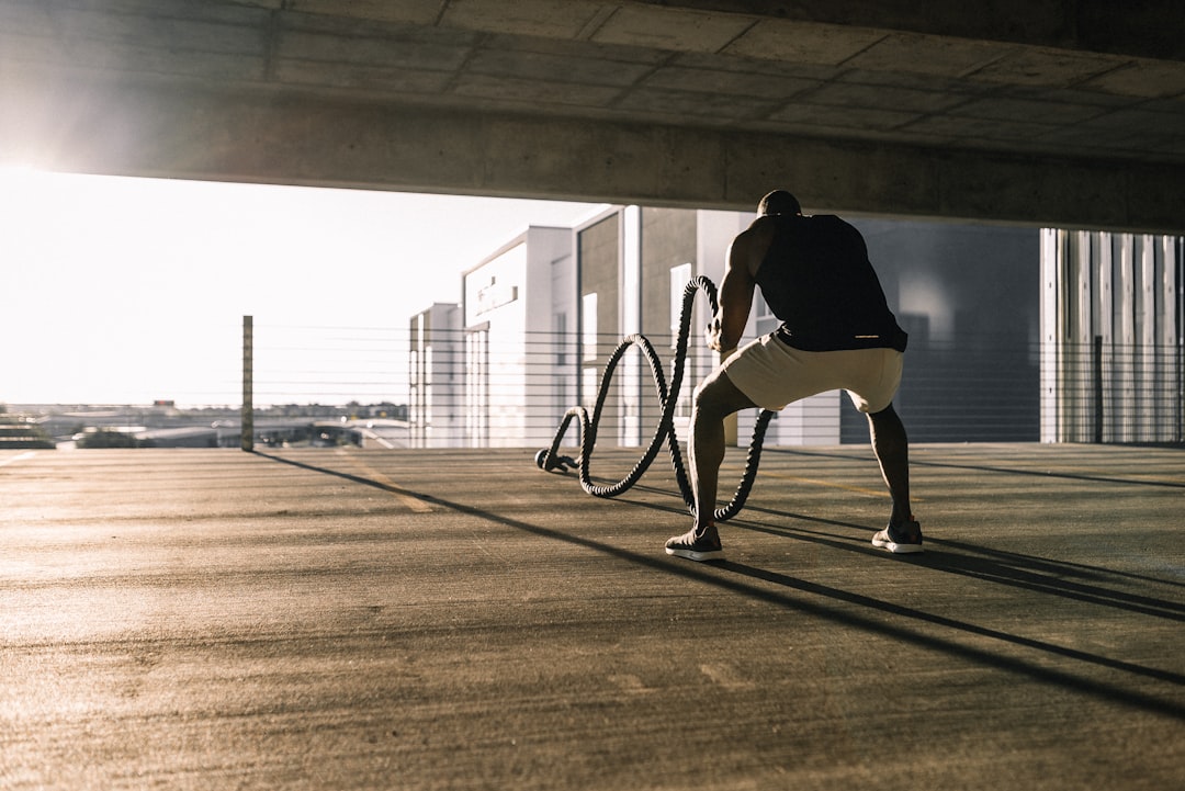 athlete checking Oura Ring app recovery data after morning run