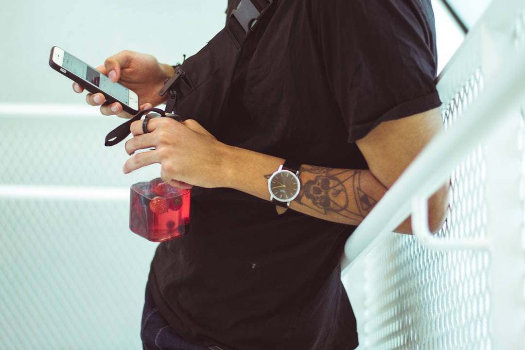 athlete reviewing fitness tracker data on phone after morning workout