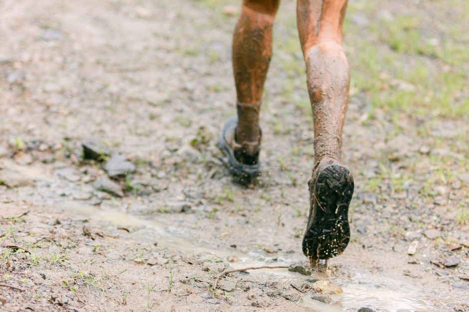 athlete wearing Xero Shoes running on UK trail terrain