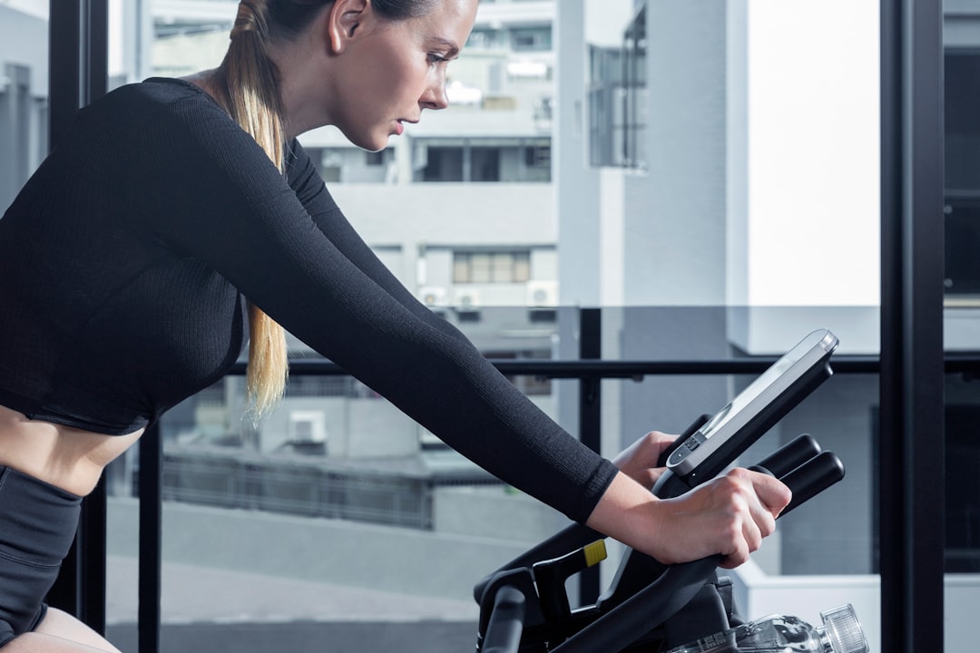 cyclist reviewing training data on tablet after indoor workout