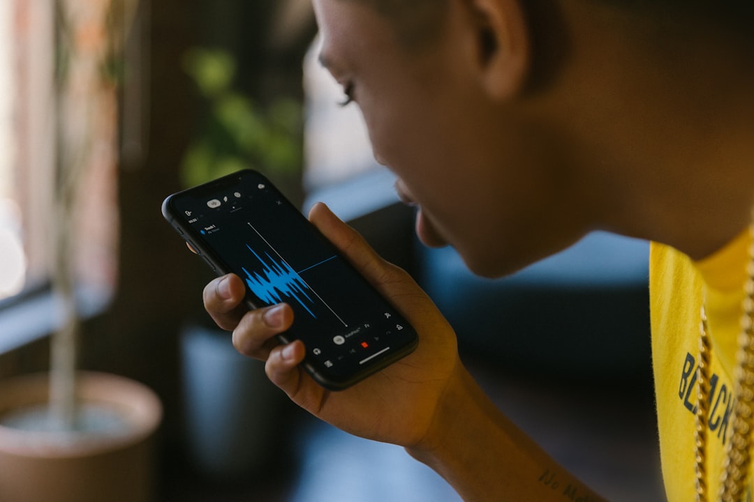 runner using GPS fitness tracking app with audio coaching earphones